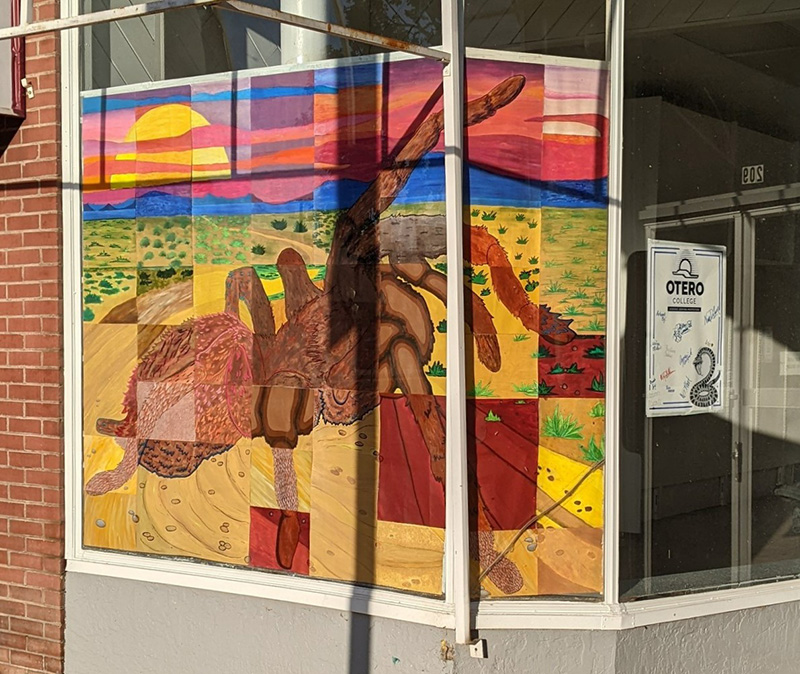 Tarantuala mural on a downtown window