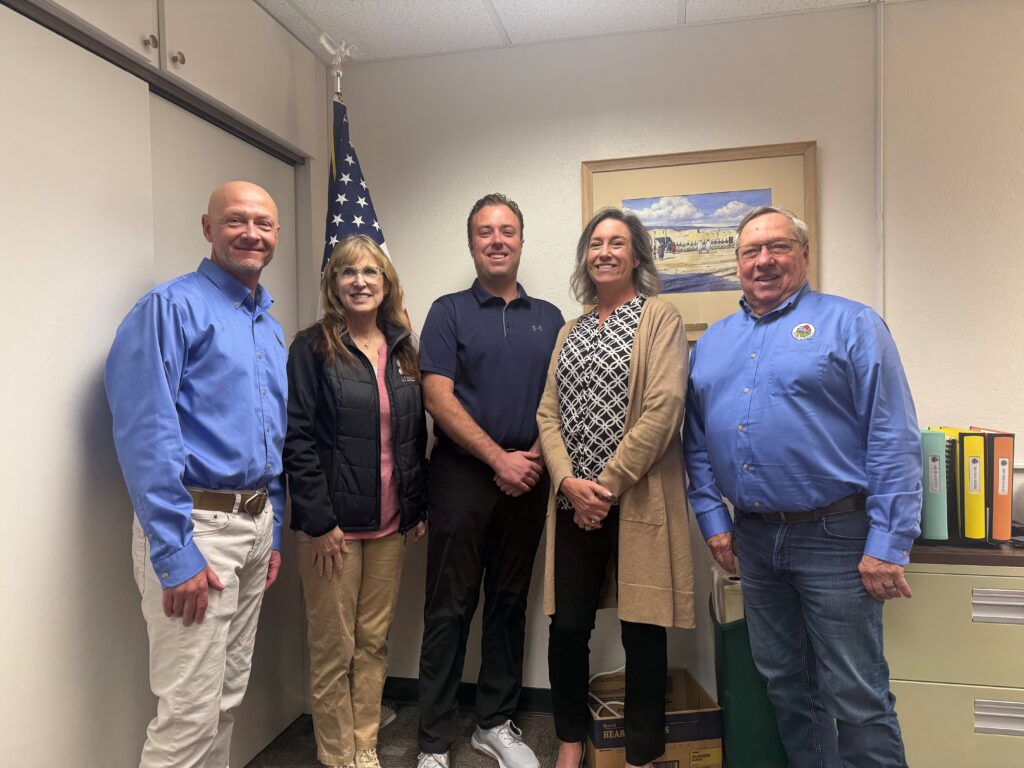 Five members of Otero County and Otero College stand together
